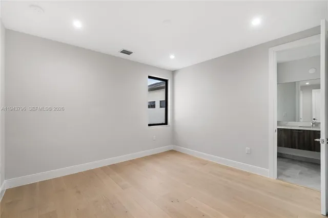 a bathroom with a granite countertop sink mirror and double