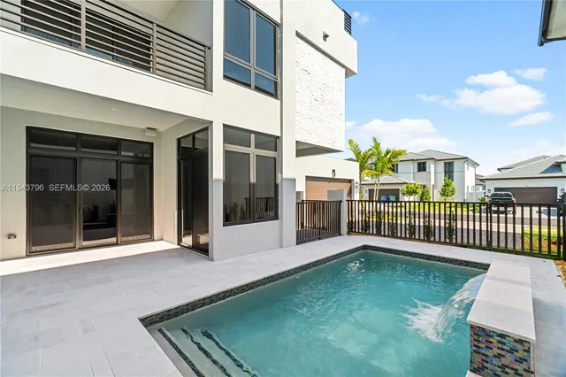 front view of a house with a swimming pool
