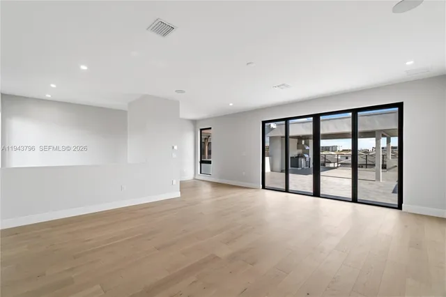 a view of a room with large windows