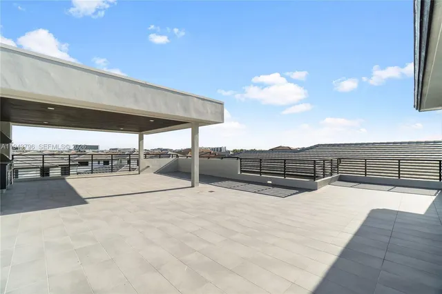 a kitchen with stainless steel appliances a stove a refrigerator and a sink