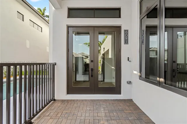 a view of a front door and wooden floor