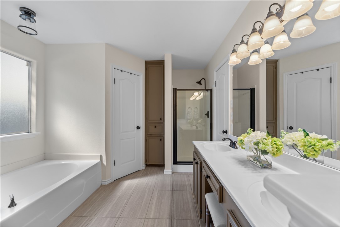 5117 Lethaby Drive Corpus Christi, TX 78413 - Photo 15 of 31 a bathroom with a bathtub sink and mirror