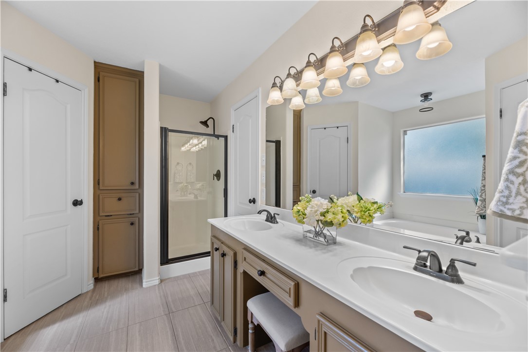 5117 Lethaby Drive Corpus Christi, TX 78413 - Photo 17 of 31 a bathroom with a sink double vanity granite and a mirror