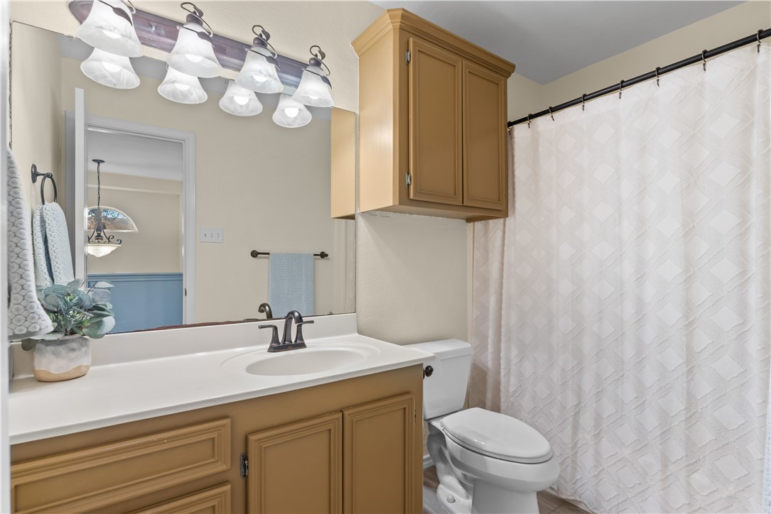 5117 Lethaby Drive Corpus Christi, TX 78413 - Photo 24 of 31 a bathroom with a sink vanity granite and toilet