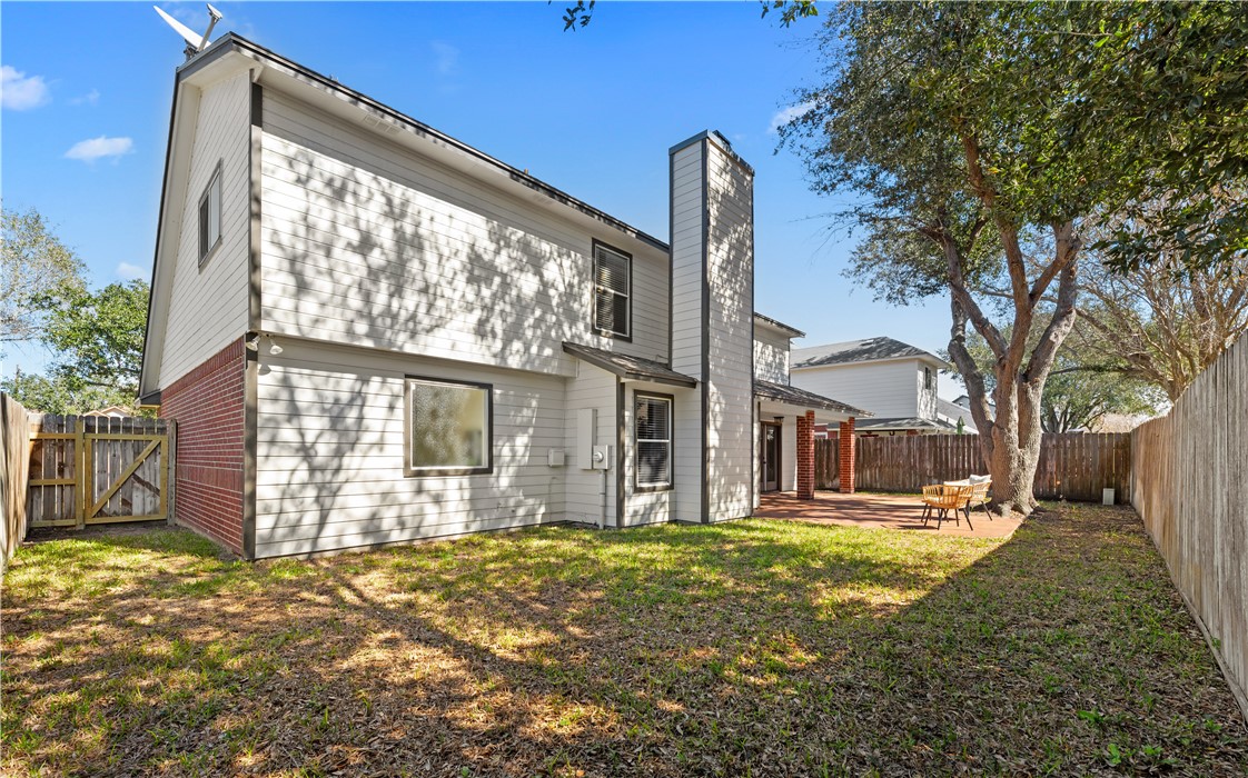 5117 Lethaby Drive Corpus Christi, TX 78413 - Photo 28 of 31 a front view of a house with a yard