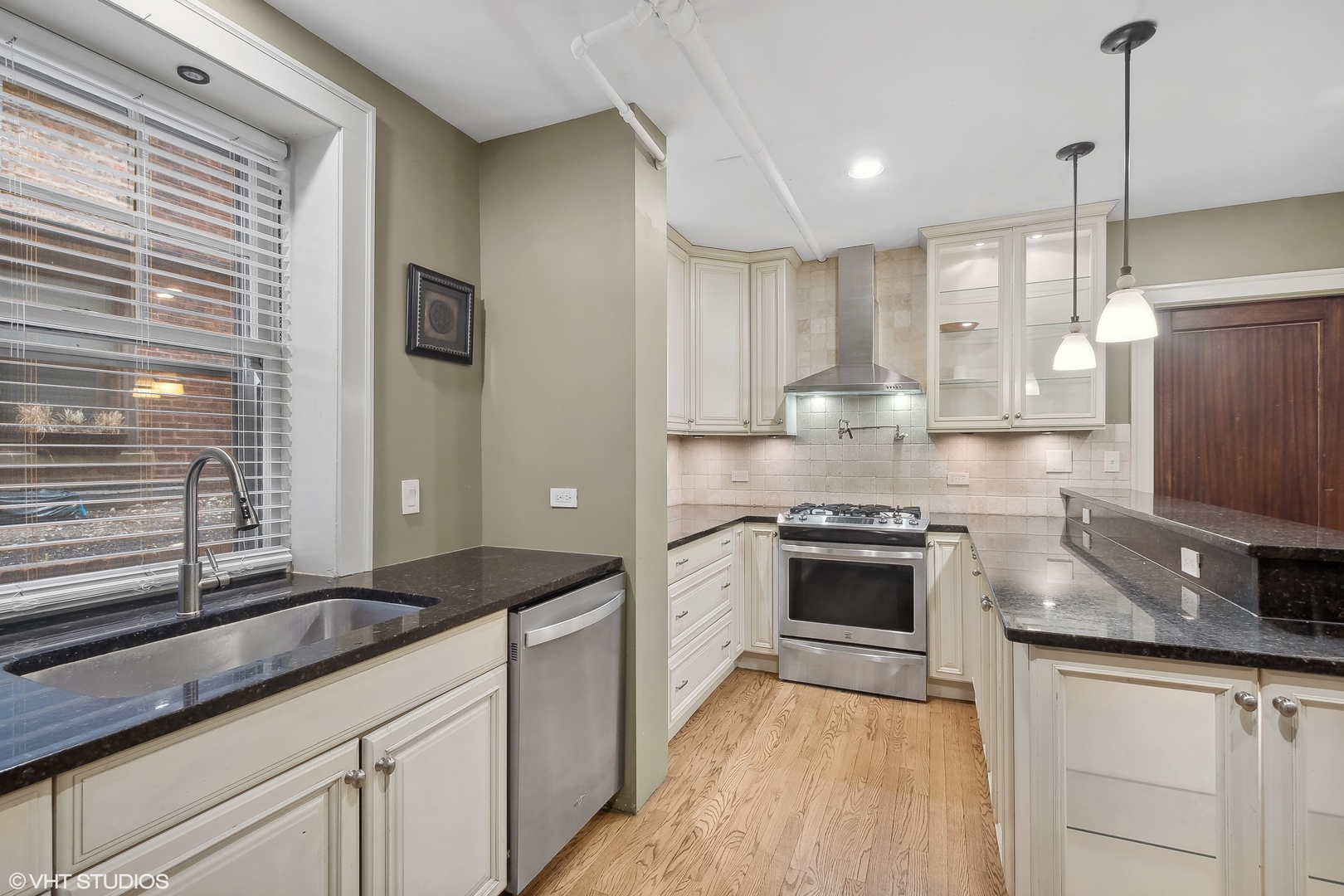 498 Sheridan Road, Unit G Evanston, IL 60202 - Photo 3 of 13 a kitchen with stainless steel appliances granite countertop a sink stove and refrigerator