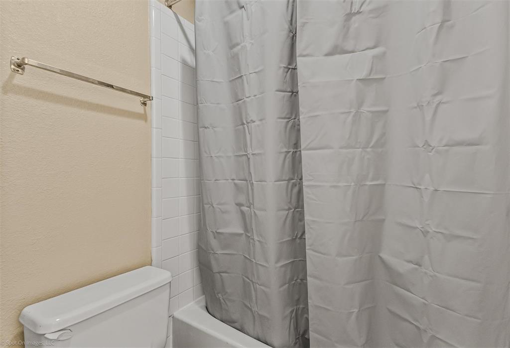 925 Signal Ridge Place Rockwall, TX 75032 - Photo 11 of 21 a bathroom with a shower and toilet