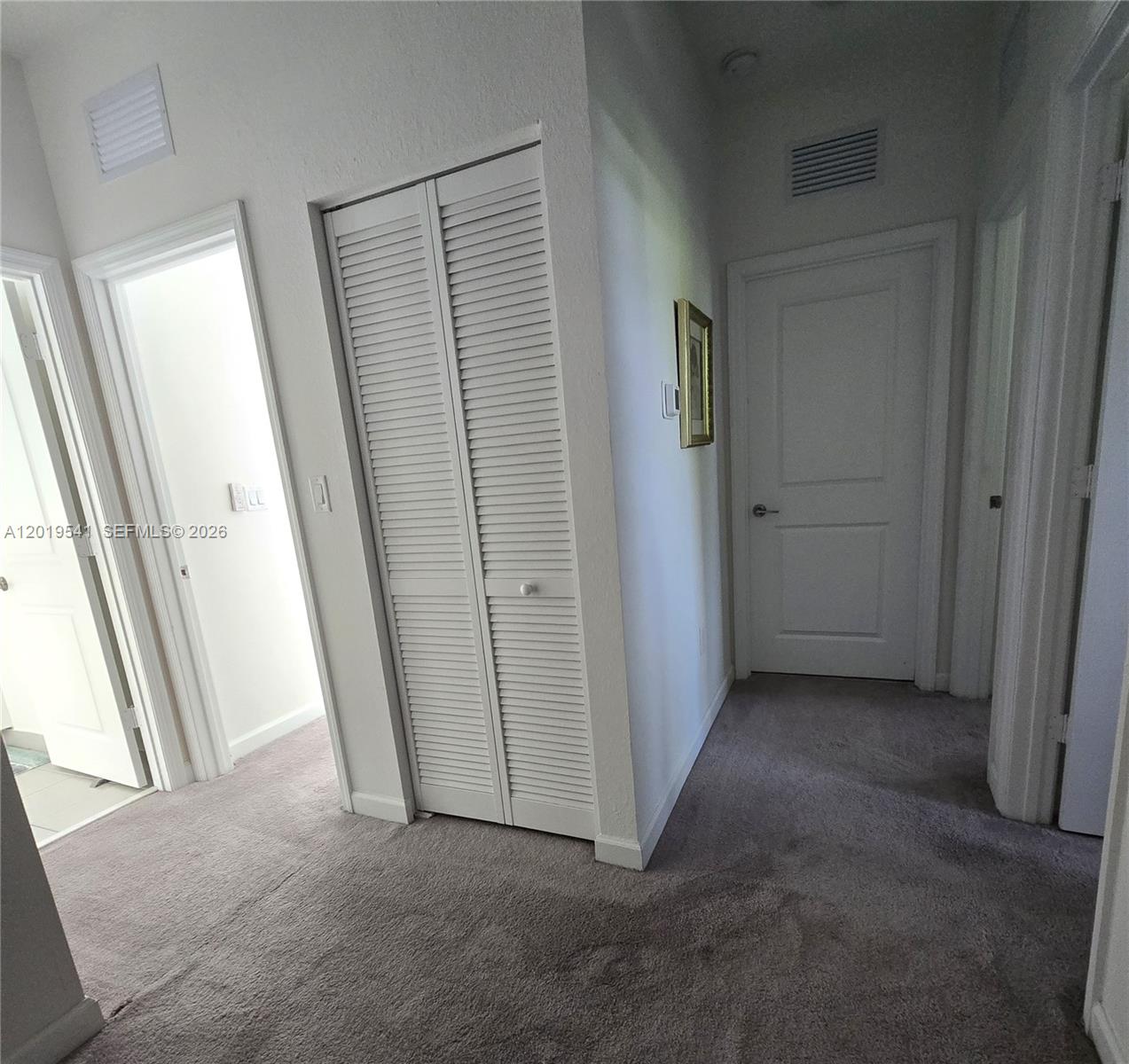 24400 Southwest 119th Place Homestead, FL 33032 - Photo 15 of 22 an empty room with windows