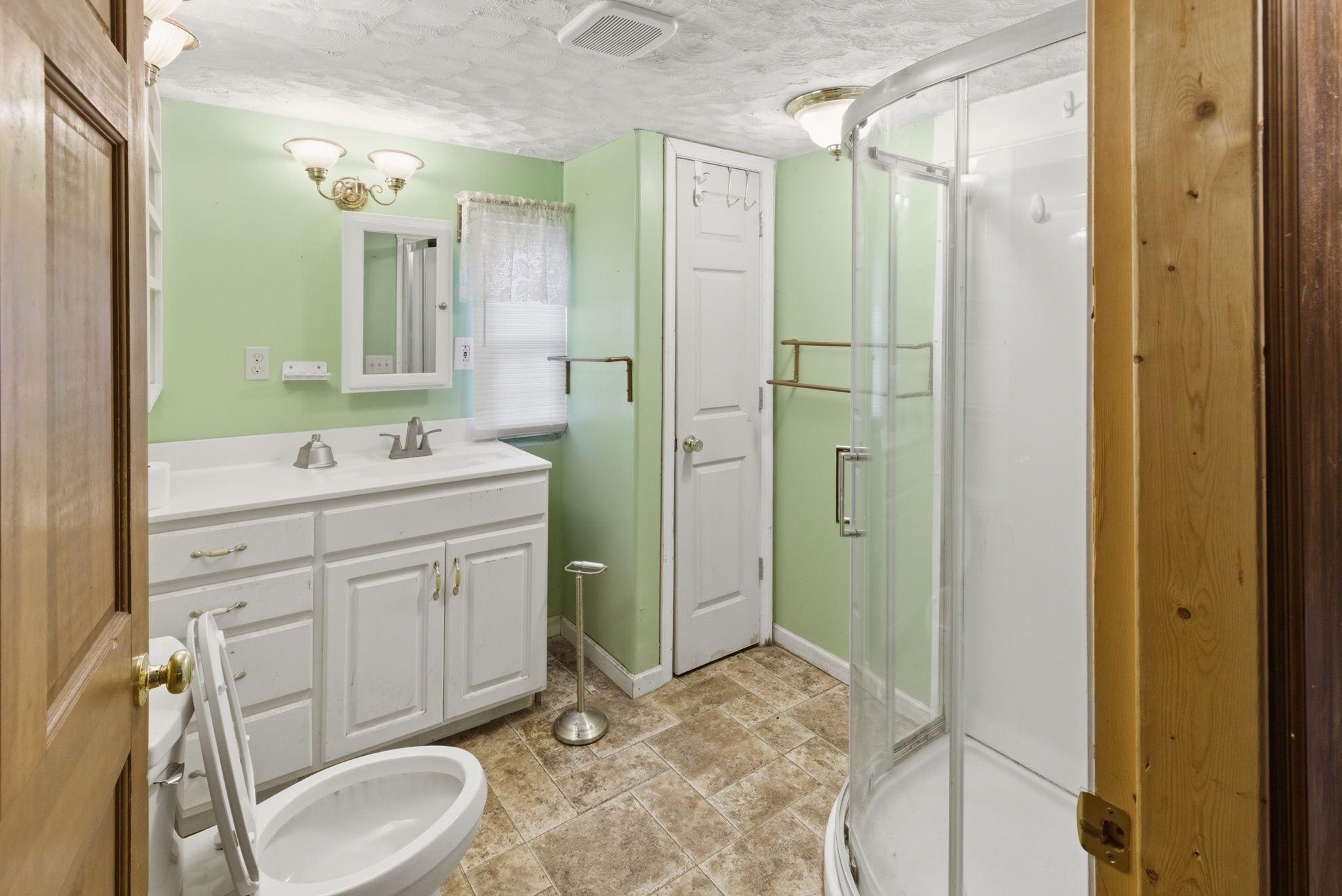 207 Center Street Portland, TN 37148 - Photo 14 of 26 a spacious bathroom with a double vanity sink mirror and shower