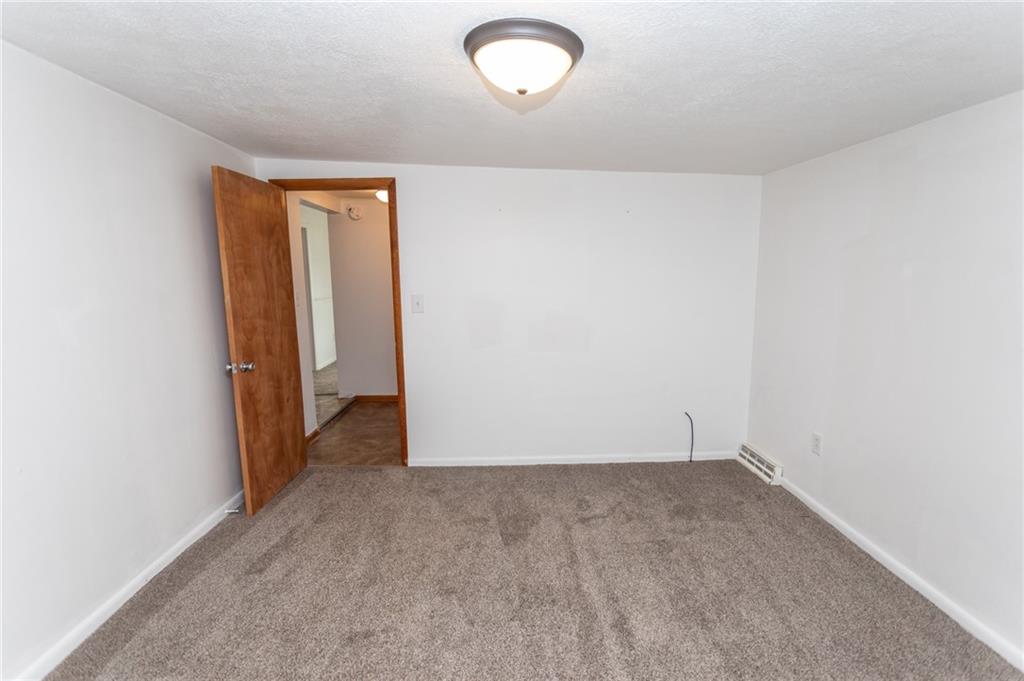 105 Jones Street Everson, PA 15631 - Photo 14 of 17 an empty room with window