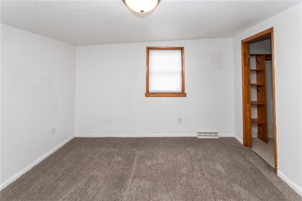 105 Jones Street Everson, PA 15631 - Photo 15 of 17 an empty room with a window