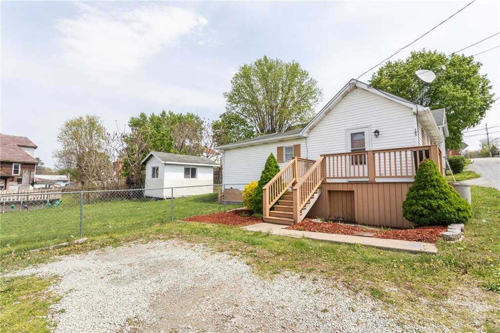 105 Jones Street Everson, PA 15631 - Photo 2 of 17 a view of a house with a yard and sitting area