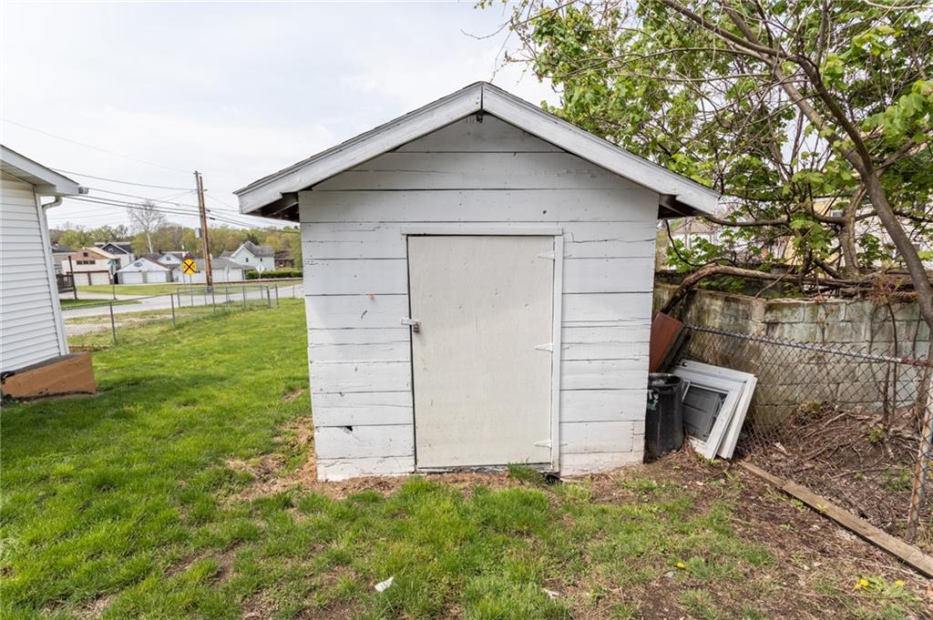 105 Jones Street Everson, PA 15631 - Photo 8 of 17 a front view of a house with garden
