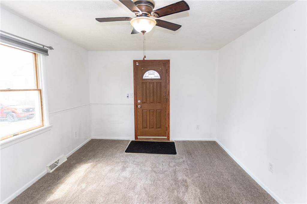 105 Jones Street Everson, PA 15631 - Photo 9 of 17 wooden floor in an empty room with a window