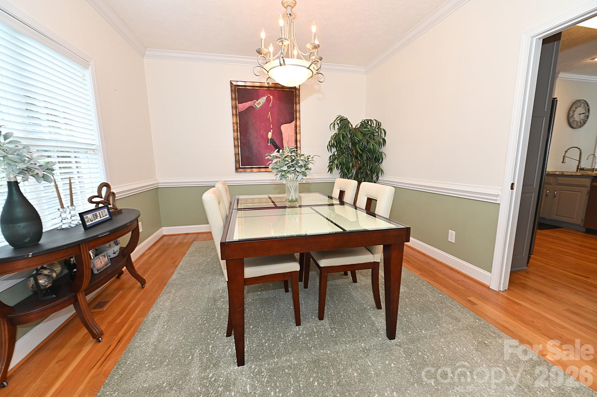 406 5th Avenue Northeast Conover, NC 28613 - Photo 15 of 46 a view of a dining room with furniture window and wooden floor