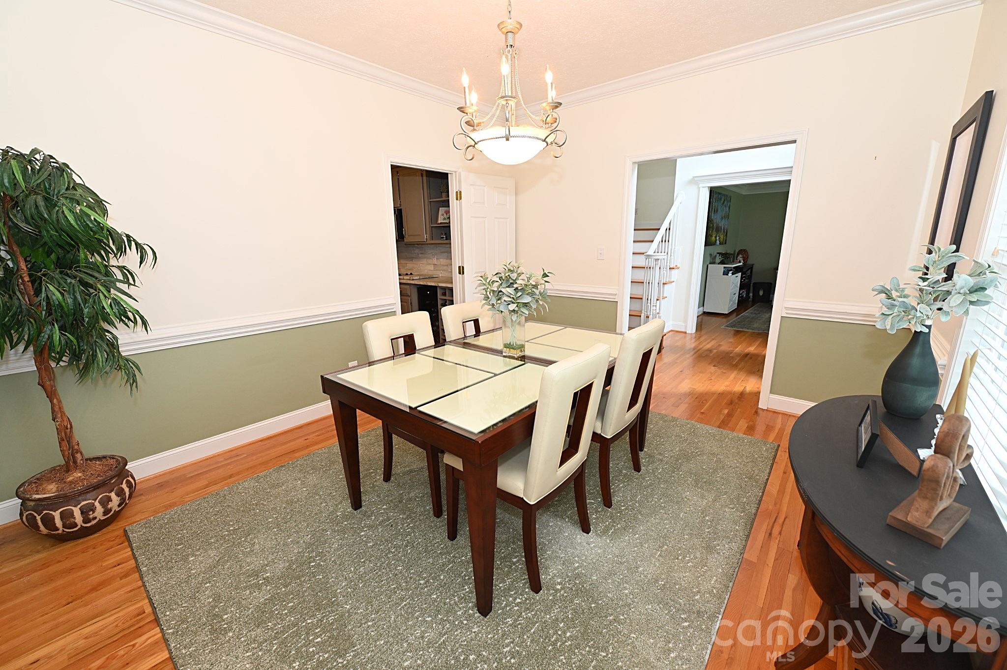 406 5th Avenue Northeast Conover, NC 28613 - Photo 16 of 46 a view of a dining room with furniture and wooden floor