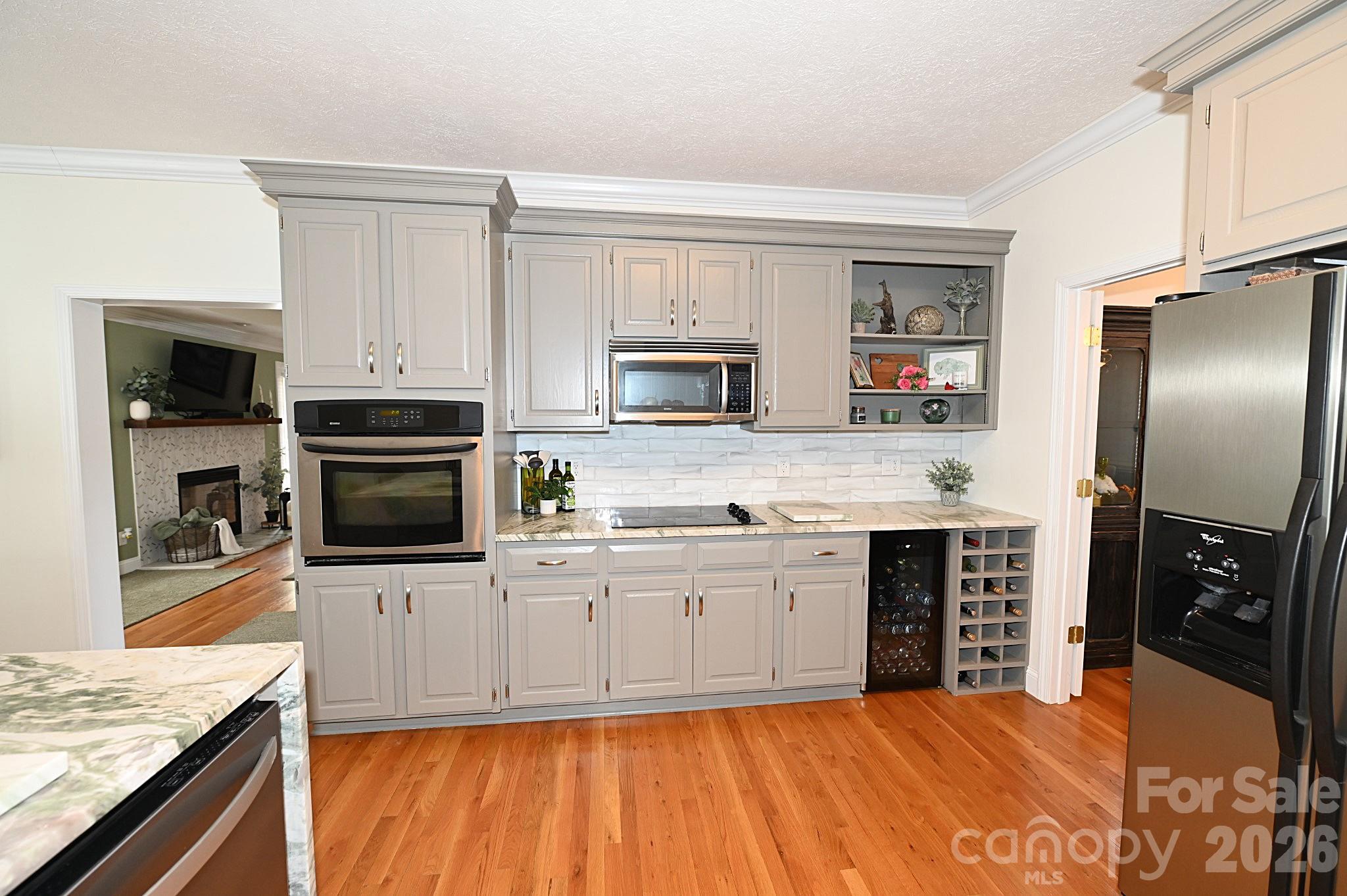 406 5th Avenue Northeast Conover, NC 28613 - Photo 18 of 46 a kitchen with stainless steel appliances granite countertop a stove top oven a sink and a microwave