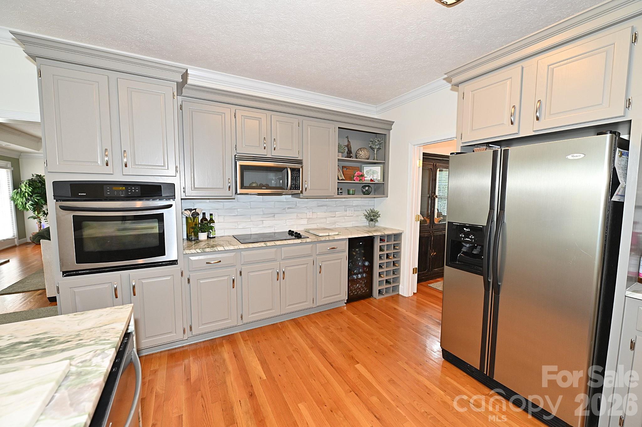 406 5th Avenue Northeast Conover, NC 28613 - Photo 19 of 46 a kitchen with stainless steel appliances granite countertop a refrigerator stove microwave and sink