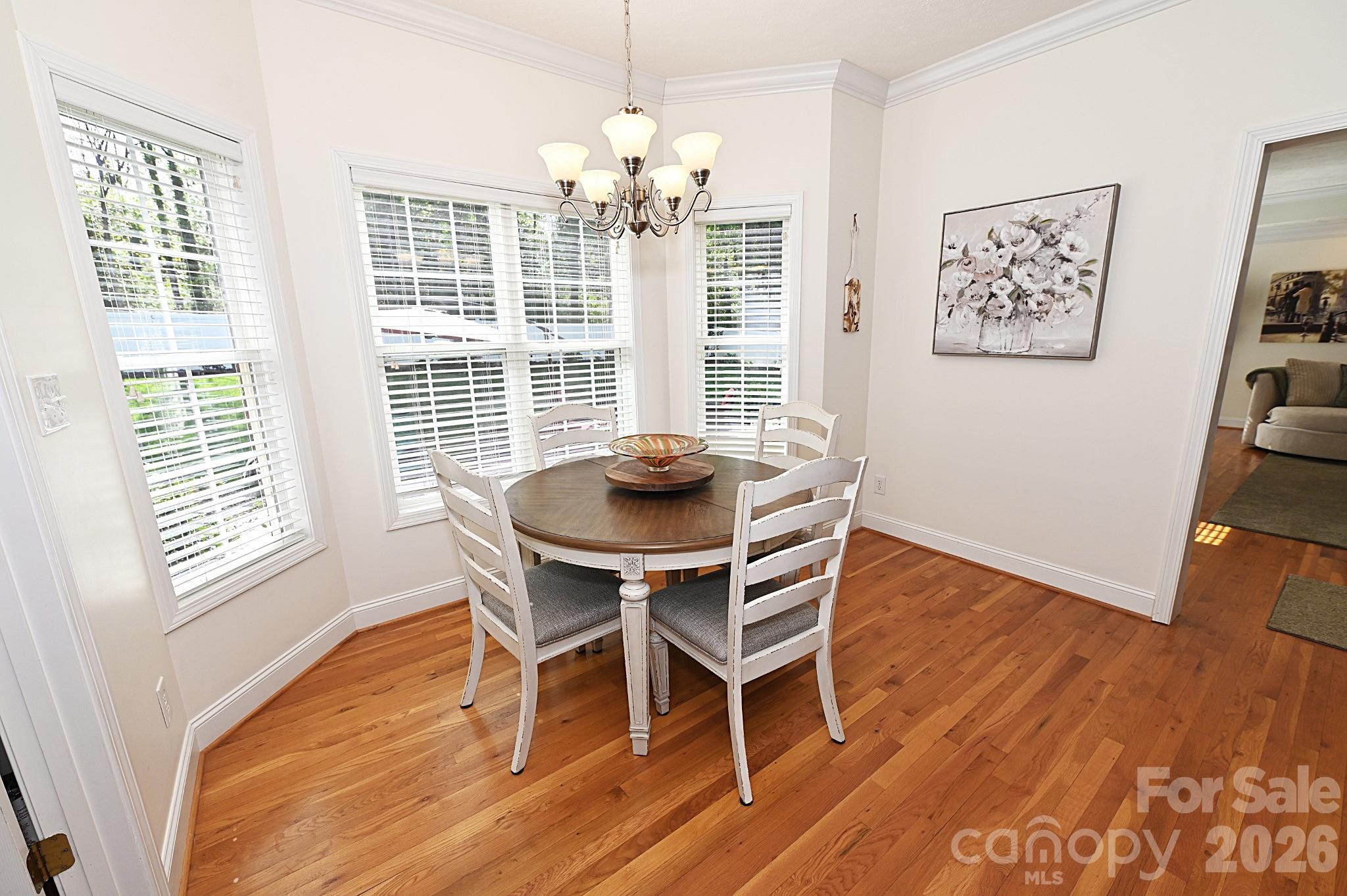 406 5th Avenue Northeast Conover, NC 28613 - Photo 20 of 46 a view of a dining room with furniture and wooden floor
