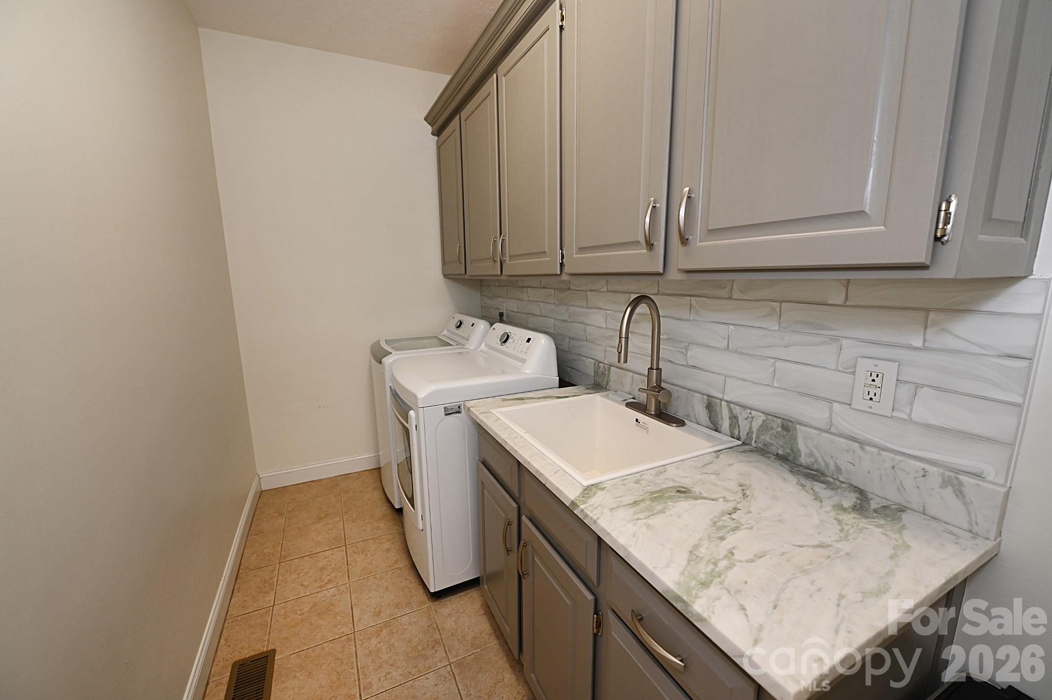 406 5th Avenue Northeast Conover, NC 28613 - Photo 31 of 46 a utility room with a sink washer and dryer