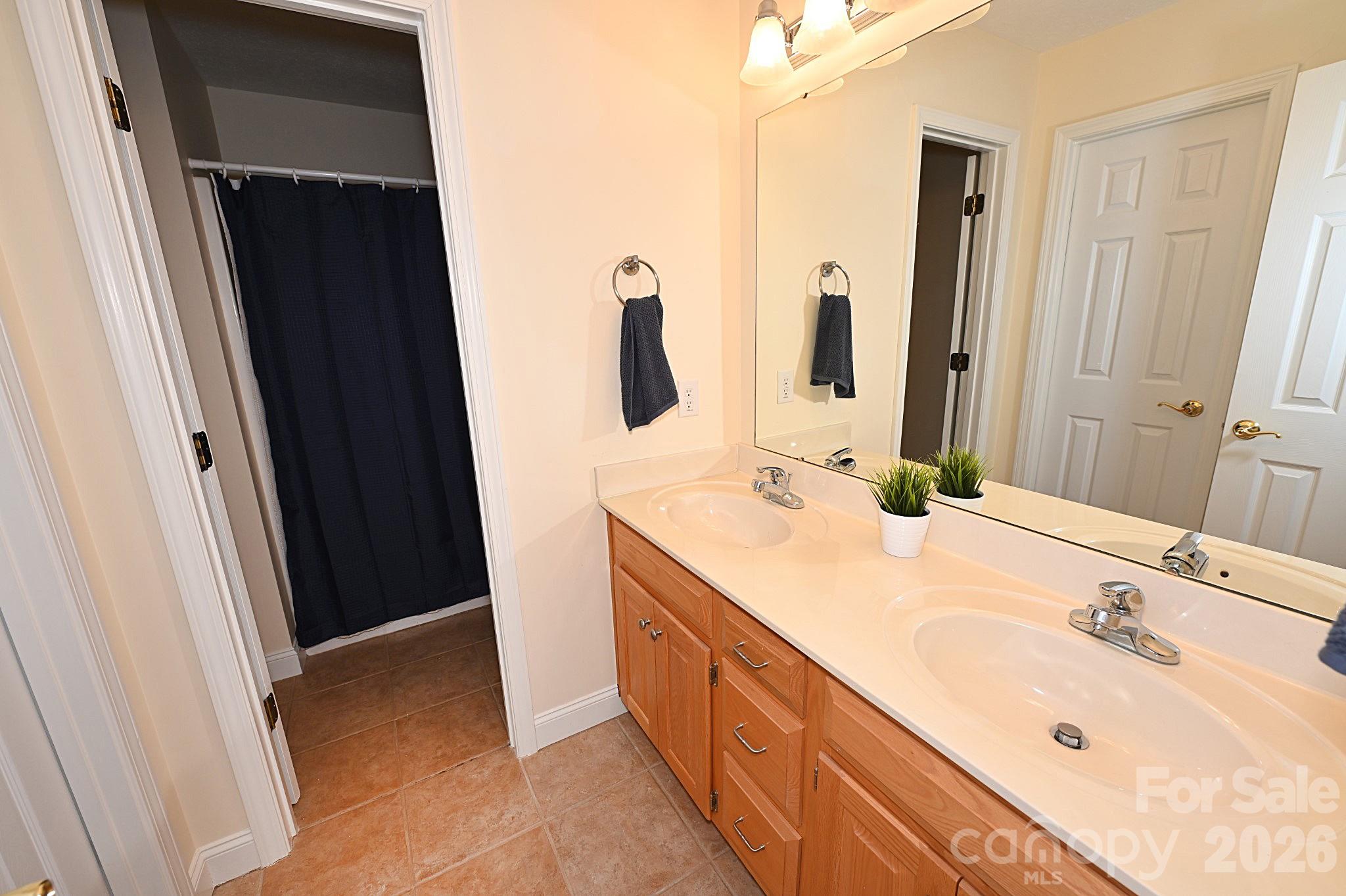 406 5th Avenue Northeast Conover, NC 28613 - Photo 38 of 46 a bathroom with a double vanity sink and mirror