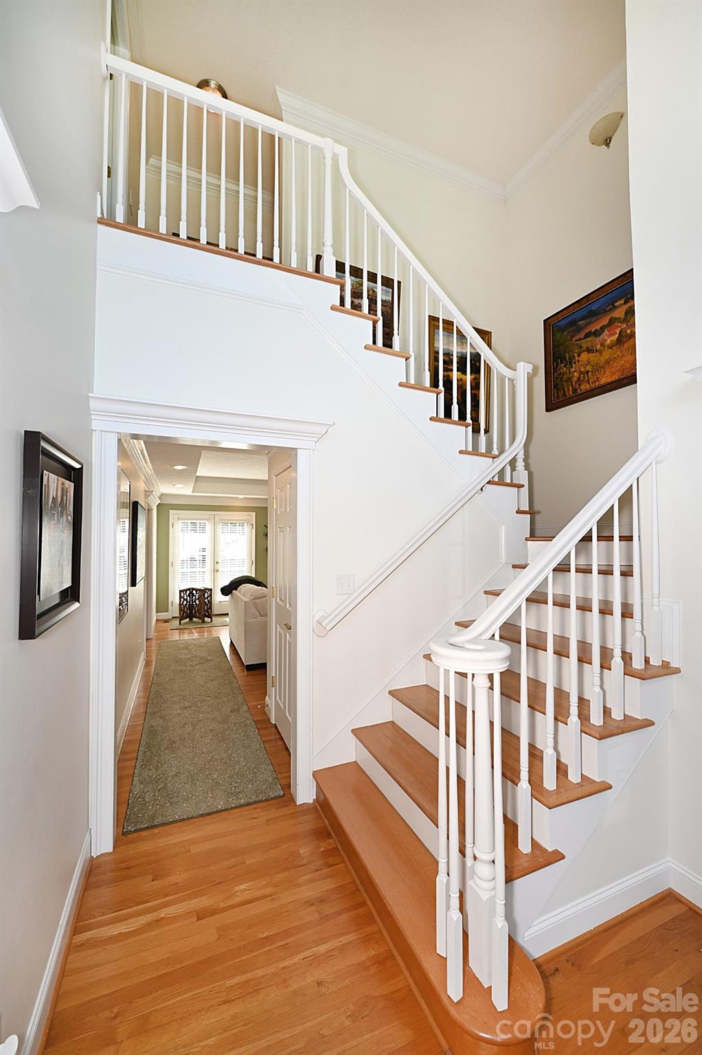406 5th Avenue Northeast Conover, NC 28613 - Photo 6 of 46 a view of staircase with lots of frames on wall and a window