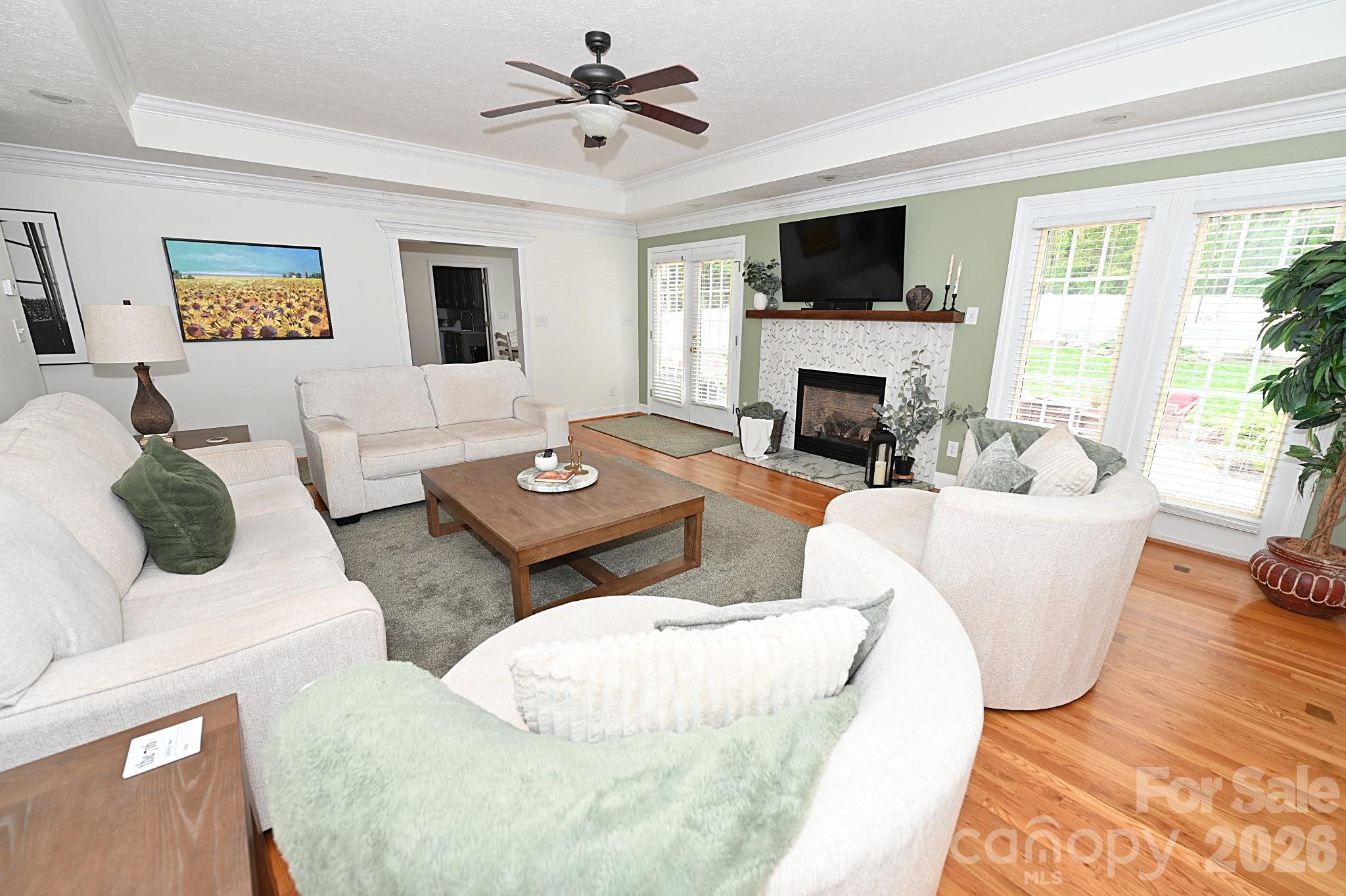 406 5th Avenue Northeast Conover, NC 28613 - Photo 8 of 46 a living room with couches a fireplace and a flat screen tv