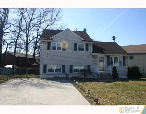 18 Wilshire Road Edison, NJ 08817 - Photo 1 of 10 a front view of a house with a yard