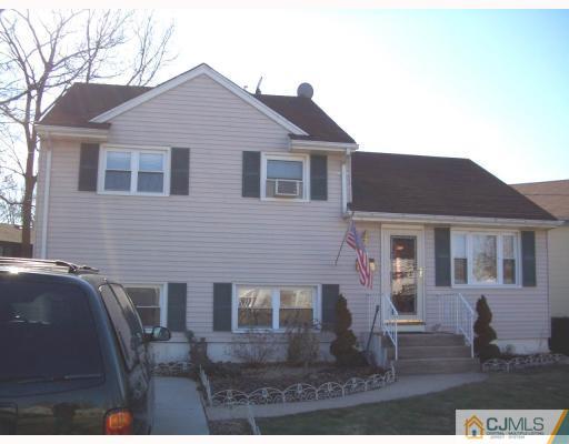 18 Wilshire Road Edison, NJ 08817 - Photo 2 of 10 a front view of a house with garden
