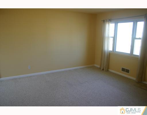 18 Wilshire Road Edison, NJ 08817 - Photo 3 of 10 a view of an empty room and window