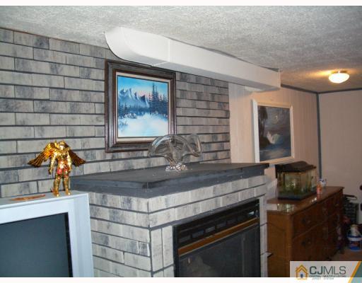 18 Wilshire Road Edison, NJ 08817 - Photo 6 of 10 a kitchen with a sink and a stove top oven