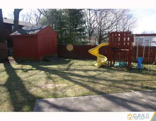 18 Wilshire Road Edison, NJ 08817 - Photo 10 of 10 a backyard of a house with barbeque oven