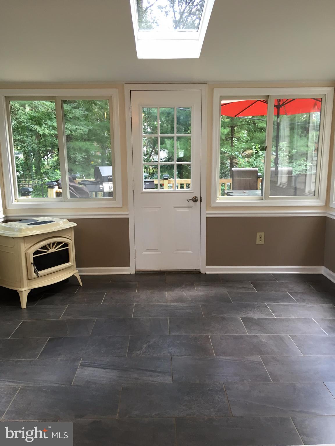 1523 Long Point Road Pasadena, MD 21122 - Photo 8 of 25 SUN-FUN-Room with Pellet Stove