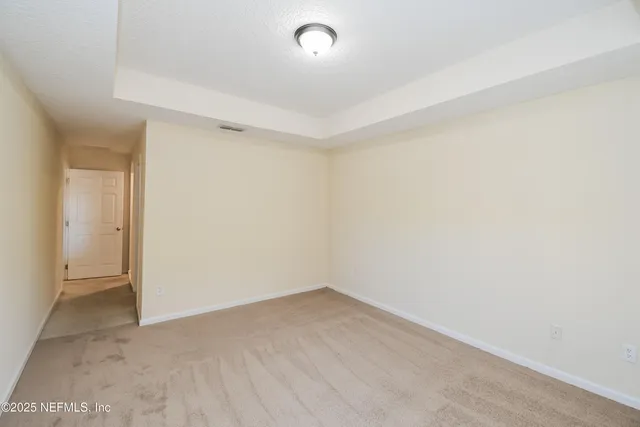 an empty room with a empty space and a window