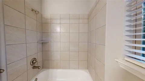 a bathroom with a sink a mirror and a shower