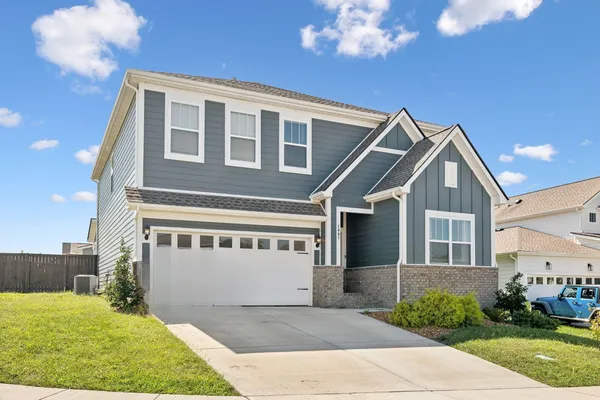 a view of house with yard