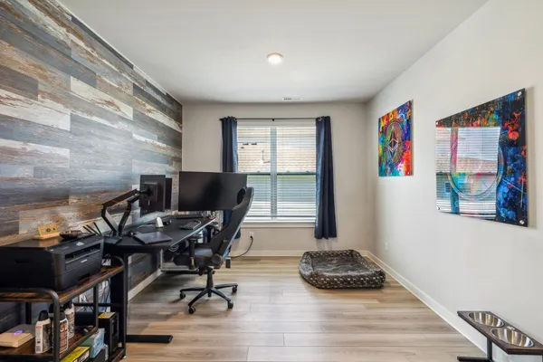 a workspace with furniture and a window