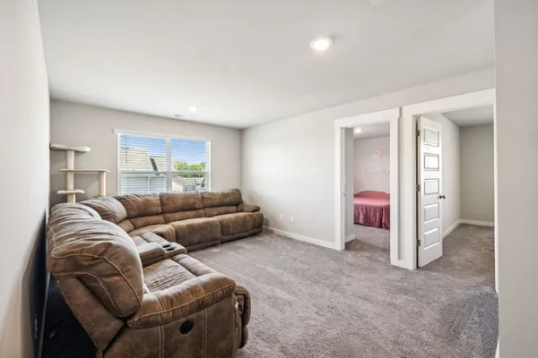a living room with furniture and a window