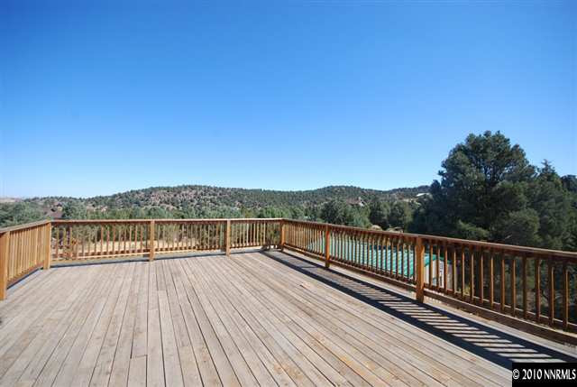 1885 Empire Road Reno, NV 89521 - Photo 11 of 13 a view of balcony with wooden floor and fence