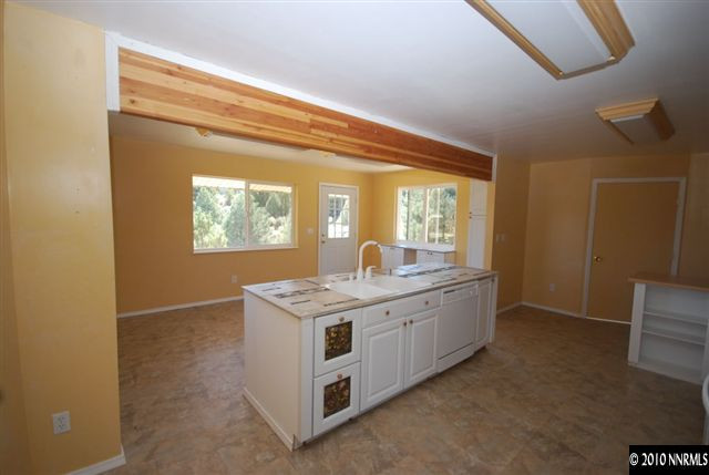 1885 Empire Road Reno, NV 89521 - Photo 2 of 13 a view of kitchen with granite countertop cabinets and window