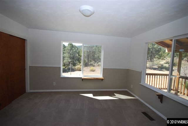 1885 Empire Road Reno, NV 89521 - Photo 5 of 13 an empty room with a window