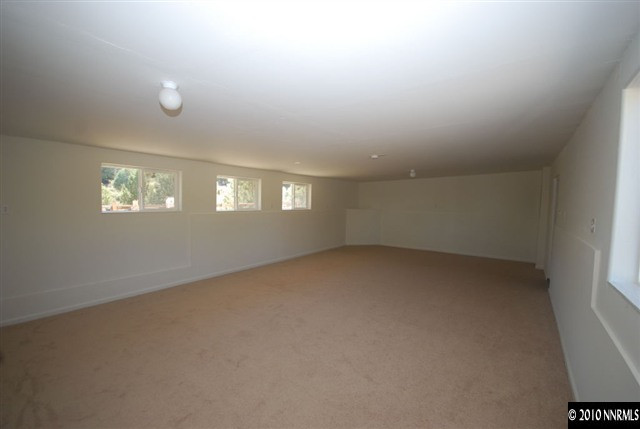 1885 Empire Road Reno, NV 89521 - Photo 7 of 13 an empty room with windows
