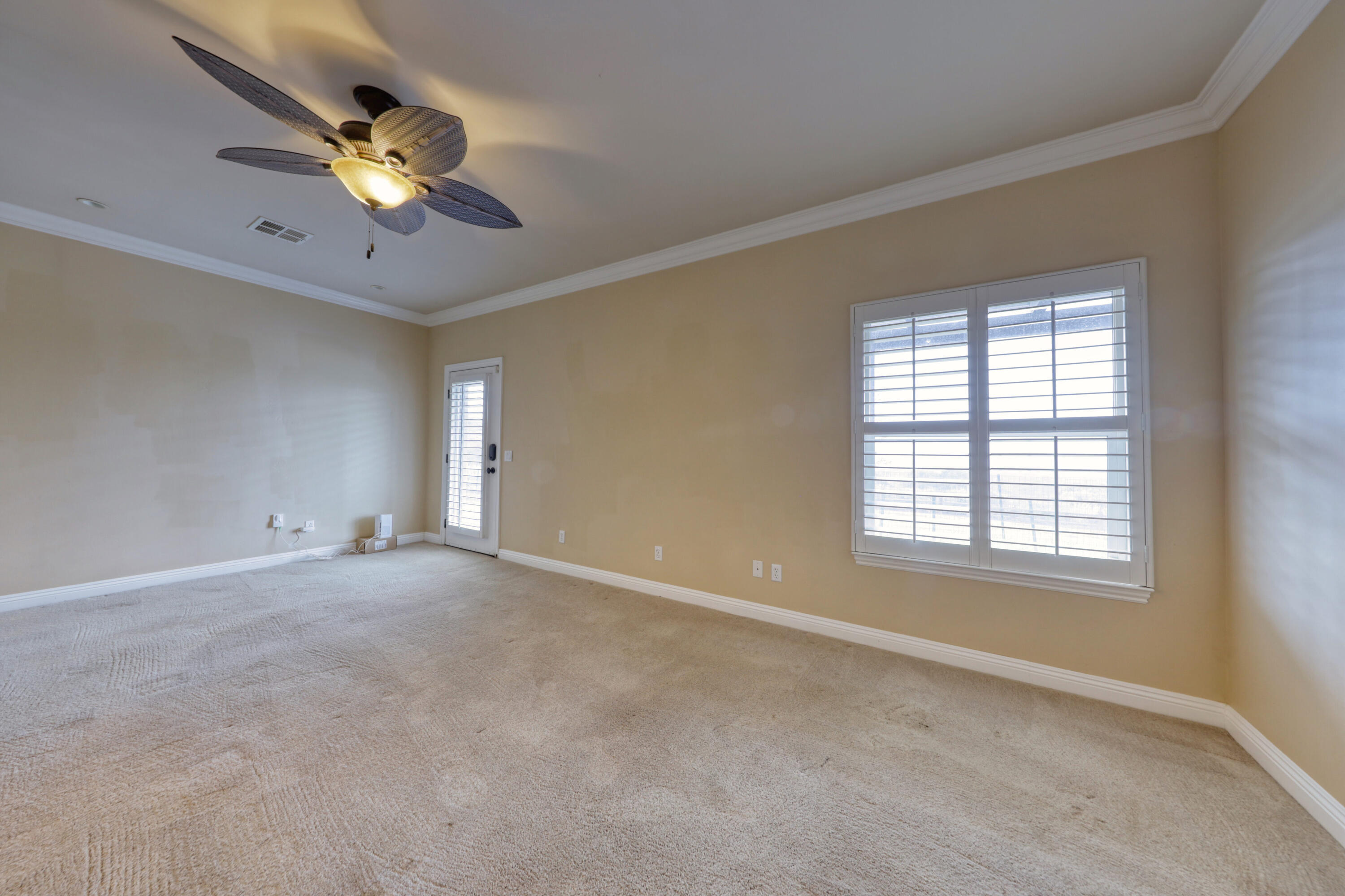 24281 Jacaranda Drive Tehachapi, CA 93561 - Photo 14 of 54 a view of an empty room with a window