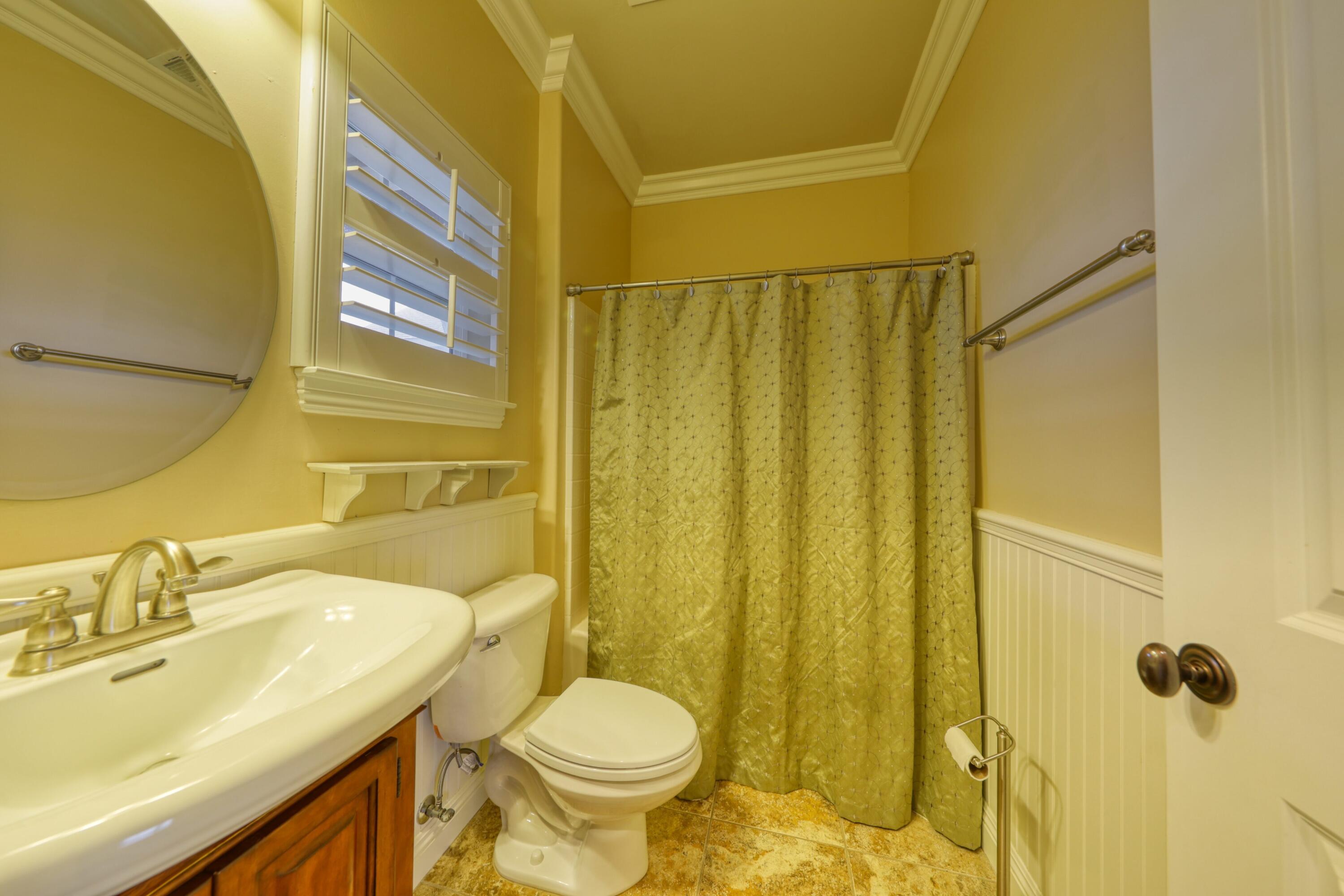 24281 Jacaranda Drive Tehachapi, CA 93561 - Photo 28 of 54 a bathroom with a sink a toilet and shower