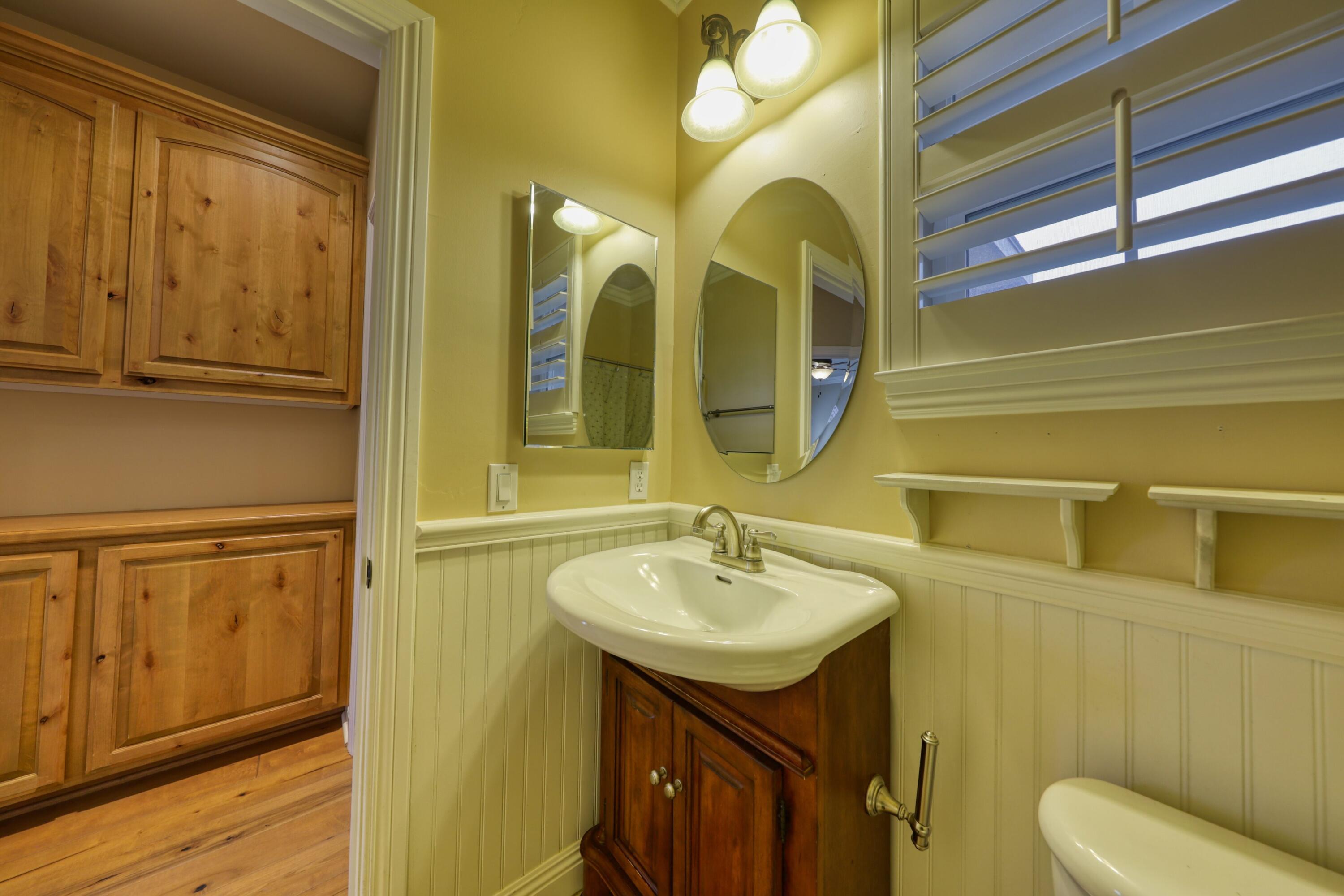 24281 Jacaranda Drive Tehachapi, CA 93561 - Photo 29 of 54 a bathroom with a sink and a mirror