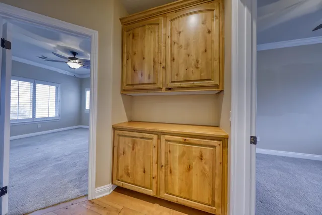 a view of a room with gym equipment and a window