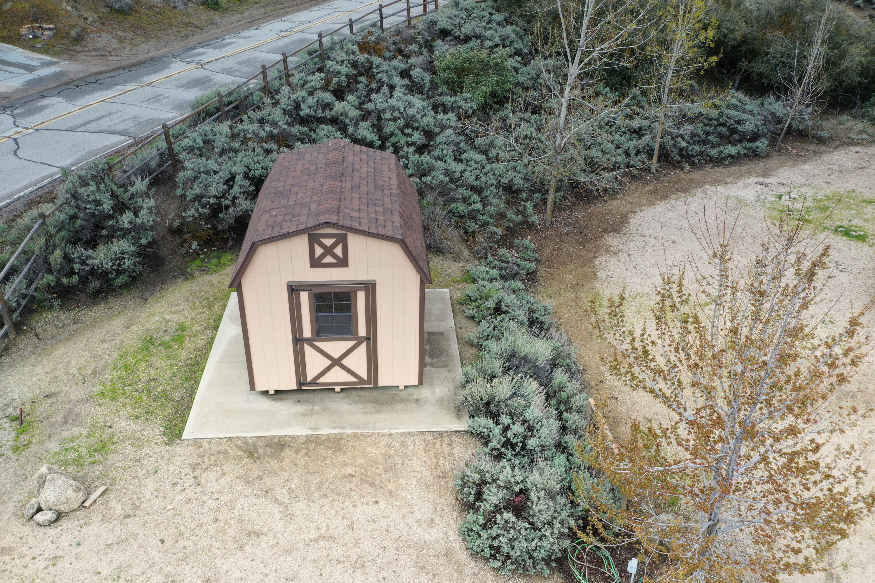 24281 Jacaranda Drive Tehachapi, CA 93561 - Photo 37 of 54 a view of a stone wall with a yard