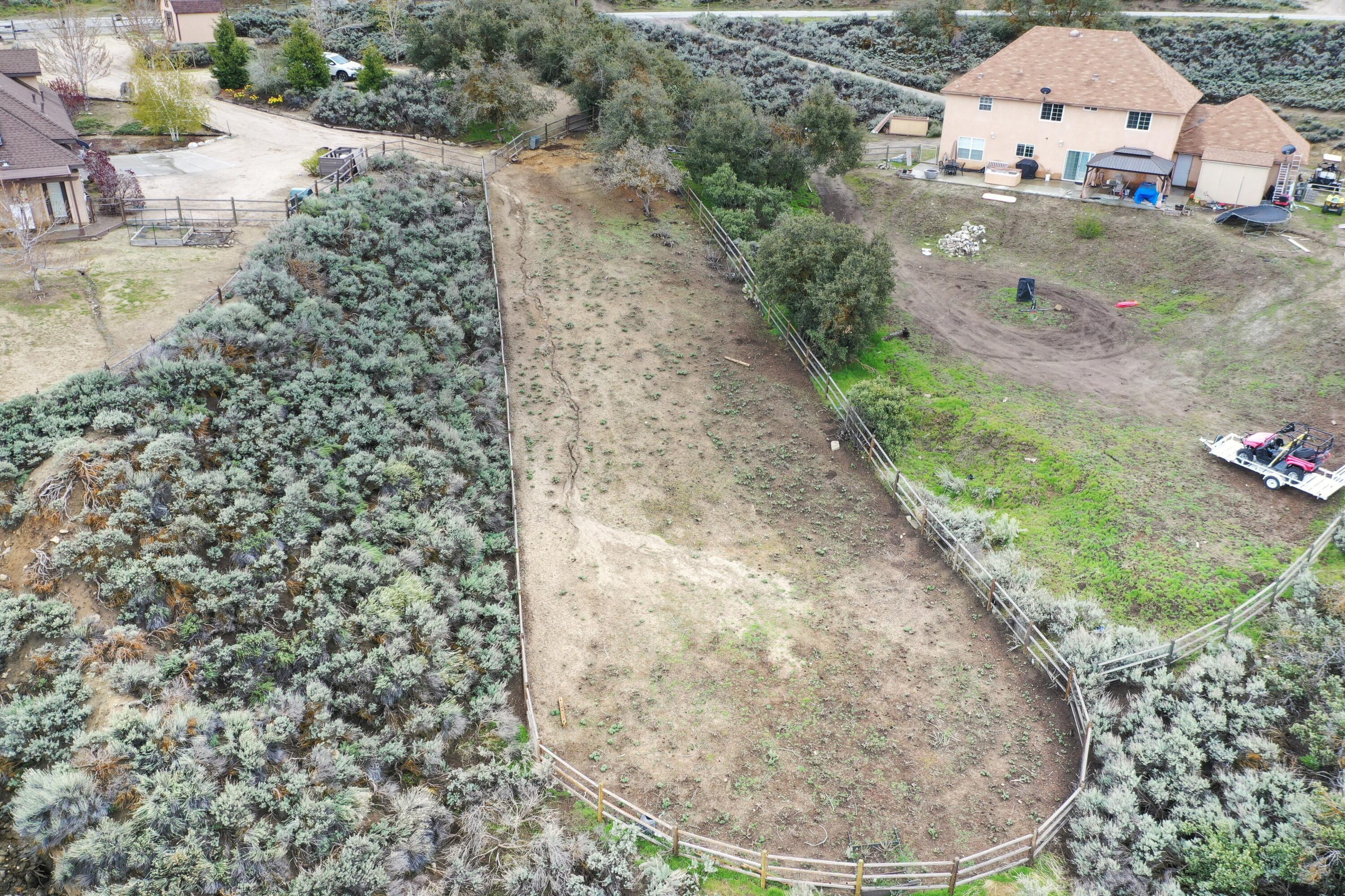 24281 Jacaranda Drive Tehachapi, CA 93561 - Photo 42 of 54 a view of a yard with a fountain
