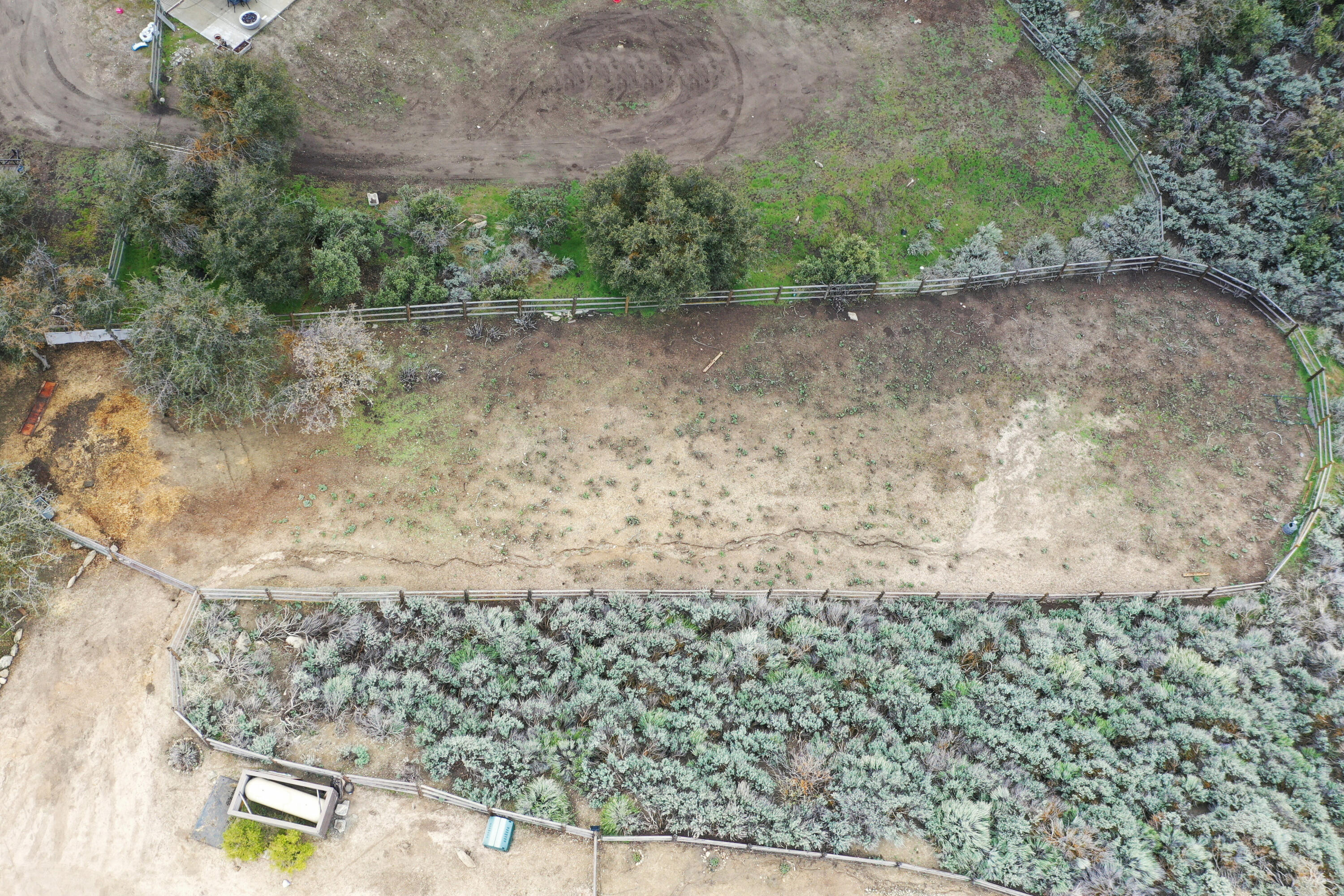 24281 Jacaranda Drive Tehachapi, CA 93561 - Photo 43 of 54 a view of a dry yard with wooden fence