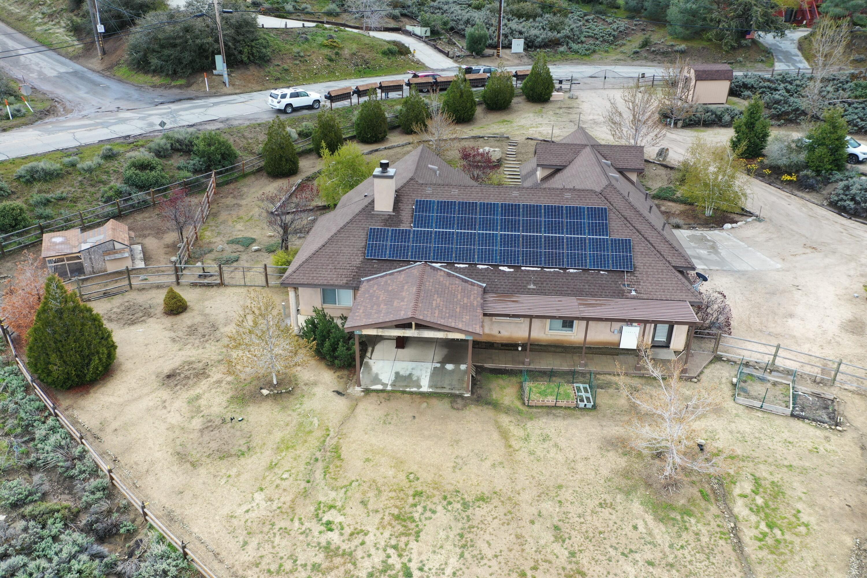 24281 Jacaranda Drive Tehachapi, CA 93561 - Photo 50 of 54 a view of a backyard with plants and lake view